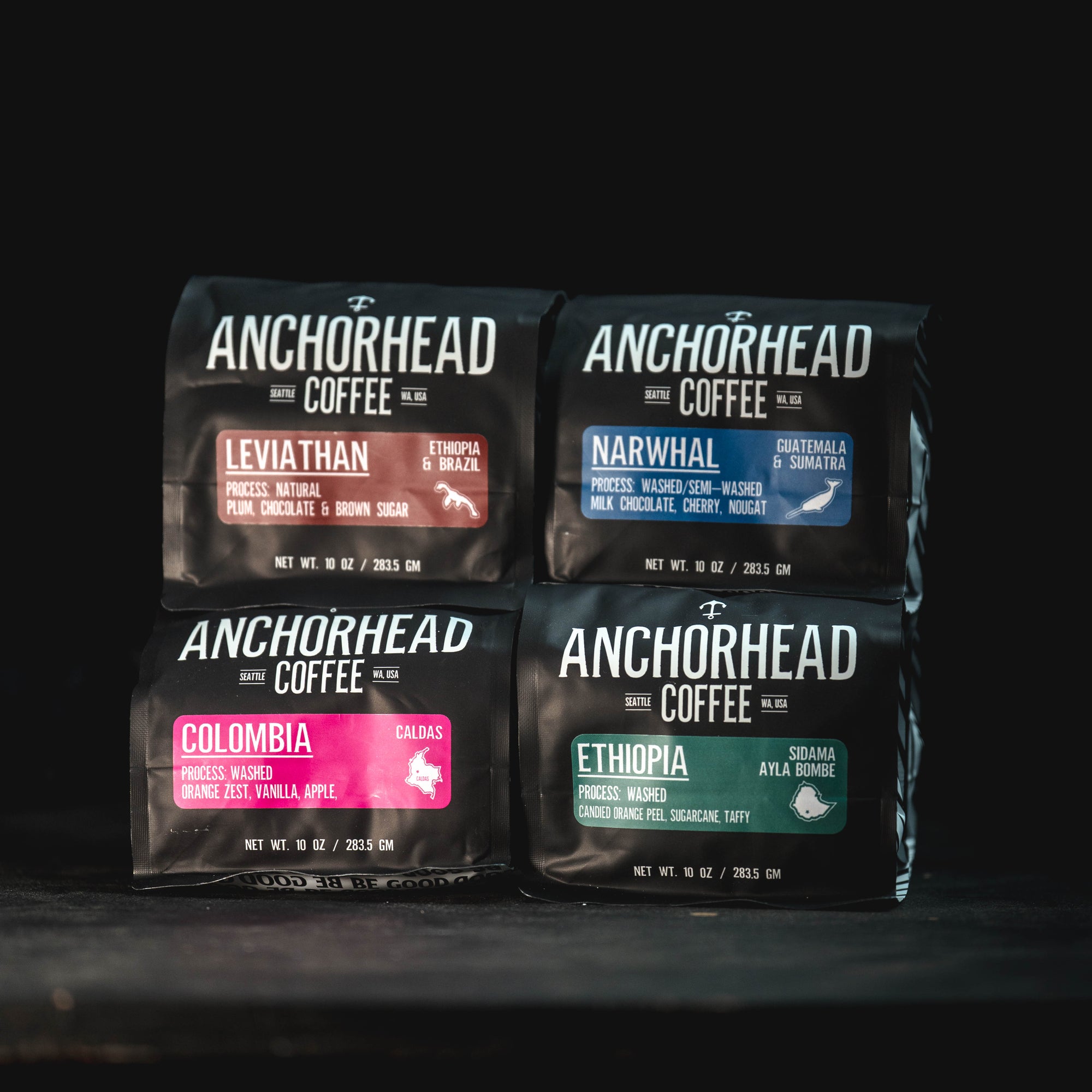 Four Anchorhead Coffee packages on a black background